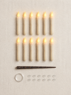 What's in the box, 12 set: 12 floating LED candles, 1 wand remote, 12 adhesive ceiling hooks and a coil of clear hanging line (batteries not included; the 24 set has double of everything)