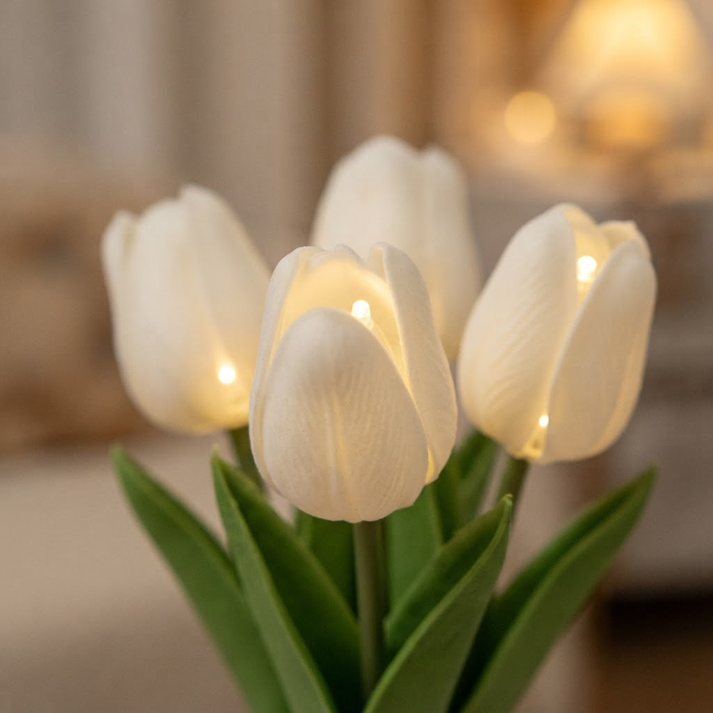 Styled illustration: close-up of the warm LED glowing inside each faux tulip bloom